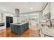 Spacious kitchen with large island, granite countertops, and stainless steel appliances at 4220 Smith Rd, Loganville, GA 30052