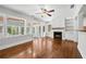 Cozy living room with natural light, fireplace, and hardwood floors for a warm atmosphere at 4220 Smith Rd, Loganville, GA 30052