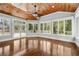 Bright sunroom with wood ceilings, hardwood floors, and large windows, perfect for relaxation at 4220 Smith Rd, Loganville, GA 30052