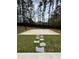 Fenced backyard featuring a basketball court and a stepping stone pathway across the yard at 5617 Casa Blanca Ln, Atlanta, GA 30331