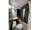 Contemporary powder room featuring an art deco mirror and vanity at 5617 Casa Blanca Ln, Atlanta, GA 30331