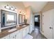 Bathroom with a soaking tub, and double vanity with marble countertops, and dual mirrors at 5617 Casa Blanca Ln, Atlanta, GA 30331