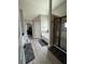 Spacious bathroom featuring a soaking tub with tile surround and walk-in shower at 5617 Casa Blanca Ln, Atlanta, GA 30331