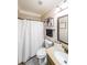 Clean bathroom with shower, tub, and vanity with granite counters and framed mirror at 5617 Casa Blanca Ln, Atlanta, GA 30331