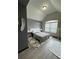 Modern bedroom with gray walls, vaulted ceiling and patterned rug at 5617 Casa Blanca Ln, Atlanta, GA 30331