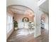 Bright dining room features modern light fixture, a large window, and white wainscoting detail at 5617 Casa Blanca Ln, Atlanta, GA 30331