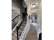 Staircase in entry foyer with hardwood stairs and decorative iron railing at 5617 Casa Blanca Ln, Atlanta, GA 30331