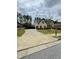 Beautiful home with lush green lawn, mature trees and an expansive driveway for ample parking at 5617 Casa Blanca Ln, Atlanta, GA 30331