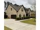 Traditional home with a brick exterior, complemented by an attached garage and well-maintained landscaping at 5617 Casa Blanca Ln, Atlanta, GA 30331