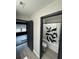 Hallway view of bathroom with tub and exercise room at 5617 Casa Blanca Ln, Atlanta, GA 30331