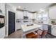 Bright kitchen with center island, stainless appliances, white cabinets, and modern finishes at 5617 Casa Blanca Ln, Atlanta, GA 30331