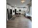 Modern kitchen with white cabinets, stainless steel appliances and island with seating at 5617 Casa Blanca Ln, Atlanta, GA 30331