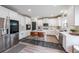 Bright, modern kitchen with stainless steel appliances, white cabinetry, and a center island at 5617 Casa Blanca Ln, Atlanta, GA 30331