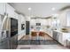 Bright, modern kitchen with stainless steel appliances, white cabinetry, and a center island at 5617 Casa Blanca Ln, Atlanta, GA 30331