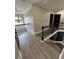 Upstairs landing featuring iron railing, and modern flooring at 5617 Casa Blanca Ln, Atlanta, GA 30331