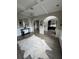 Bright living room with elegant trim, arched doorways and unique lighting fixture at 5617 Casa Blanca Ln, Atlanta, GA 30331