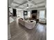 Open concept living room with fireplace, coffered ceiling, and modern finishes at 5617 Casa Blanca Ln, Atlanta, GA 30331