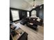 Cozy living room with dark walls, and a view into the arched entry of the bedroom at 5617 Casa Blanca Ln, Atlanta, GA 30331