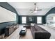 Relax in the Gathering media room with comfortable seating, a large screen, and stylish decor at 5617 Casa Blanca Ln, Atlanta, GA 30331