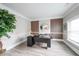 Home office with wood accent wall, clean finishes and large windows for ample natural light at 5617 Casa Blanca Ln, Atlanta, GA 30331