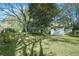 The backyard features a storage shed and lush greenery, providing ample space for gardening or recreation at 1830 Mayfield Rd, Alpharetta, GA 30009