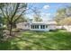 Expansive backyard with lush green grass and mature trees, perfect for outdoor enjoyment at 1830 Mayfield Rd, Alpharetta, GA 30009