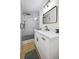 Bathroom featuring a glass-enclosed shower, updated vanity, and hardwood floors at 1830 Mayfield Rd, Alpharetta, GA 30009