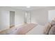 Comfortable bedroom with neutral walls, hardwood floors, and closet space at 1830 Mayfield Rd, Alpharetta, GA 30009