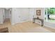 Light and bright entryway with wood floors, console table and coat closet at 1830 Mayfield Rd, Alpharetta, GA 30009