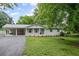 Charming single-story home with covered porch, carport and landscaped front yard at 1830 Mayfield Rd, Alpharetta, GA 30009