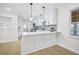 Beautiful kitchen with white cabinets, stainless steel appliances, and a breakfast bar at 1830 Mayfield Rd, Alpharetta, GA 30009