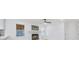 Bright living room featuring a brick fireplace, wainscotting, and many windows at 1830 Mayfield Rd, Alpharetta, GA 30009