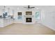 Sunlit living room featuring a modern fireplace and light wood floors at 1830 Mayfield Rd, Alpharetta, GA 30009