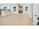 Bright open-concept living room with a white brick fireplace at 1830 Mayfield Rd, Alpharetta, GA 30009