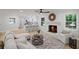 Open-concept living room with brick fireplace, hardwood floors and natural light at 1830 Mayfield Rd, Alpharetta, GA 30009