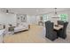 Open floor plan living room and dining area with hardwood floors and modern decor at 1830 Mayfield Rd, Alpharetta, GA 30009