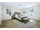 Bright primary bedroom with ample natural light, wood floors, and rustic decor at 1830 Mayfield Rd, Alpharetta, GA 30009