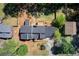 Expansive aerial view showcases property layout with lush lawn, deck, and mature trees surrounding the home at 4544 Savage Ne Dr, Marietta, GA 30066