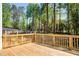 Wooden back deck overlooking a yard with mature trees at 4544 Savage Ne Dr, Marietta, GA 30066