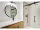 Modern bathroom with a sleek vanity, matte black fixtures, and frameless glass shower at 4544 Savage Ne Dr, Marietta, GA 30066