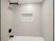 Shower with square rainfall shower head and built-in shelf at 4544 Savage Ne Dr, Marietta, GA 30066