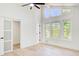 Bright bedroom features large windows, a modern ceiling fan, and sliding glass doors at 4544 Savage Ne Dr, Marietta, GA 30066