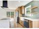 Modern kitchen with stainless steel appliances, custom cabinets, and an open layout with an outside deck view at 4544 Savage Ne Dr, Marietta, GA 30066
