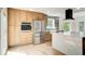 Modern kitchen featuring stainless steel appliances, custom cabinets, and a large center island at 4544 Savage Ne Dr, Marietta, GA 30066