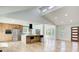 Open-concept living area with vaulted ceilings, hardwood floors, modern kitchen, and large windows at 4544 Savage Ne Dr, Marietta, GA 30066
