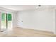 Bright room featuring wood floors, a sliding glass door to the deck, and neutral wall paint at 4544 Savage Ne Dr, Marietta, GA 30066