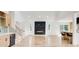 Open living space featuring a fireplace accent wall, modern light fixtures, and a kitchen bar at 4544 Savage Ne Dr, Marietta, GA 30066