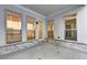 Covered patio features white brick foundation, white siding, and many windows at 504 Otwell Ave, Cumming, GA 30040