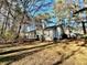 A one-story home with a spacious backyard with mature trees at 9921 Al Cooper Trce, Jonesboro, GA 30238