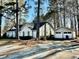 A one-story home with a detached two-car garage and mature trees at 9921 Al Cooper Trce, Jonesboro, GA 30238